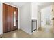 Bright entryway with modern wooden door and light hardwood floors at 2206 Alpine Dr, Boulder, CO 80304