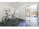 Bright exercise room featuring modern equipment and glass doors leading to the interior and exterior spaces at 2206 Alpine Dr, Boulder, CO 80304