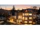 Contemporary home featuring multiple balconies with stunning mountain views at sunset, creating a serene and luxurious retreat at 2206 Alpine Dr, Boulder, CO 80304