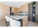 Modern kitchen featuring sleek light wood cabinets, a white countertop island, and minimalist pendant lighting at 2206 Alpine Dr, Boulder, CO 80304