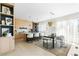 Bright kitchen and dining area featuring modern cabinetry, a large island, and stylish pendant lighting at 2206 Alpine Dr, Boulder, CO 80304