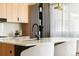 Modern kitchen with a waterfall island and stylish light fixtures at 2206 Alpine Dr, Boulder, CO 80304