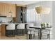 Modern kitchen with breakfast bar, sleek cabinets, and unique lighting fixtures. Perfect for entertaining and daily living at 2206 Alpine Dr, Boulder, CO 80304