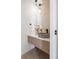 Modern powder room with floating vanity and designer sink at 2206 Alpine Dr, Boulder, CO 80304