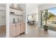 Modern wet bar with sleek cabinetry and marble backsplash at 2206 Alpine Dr, Boulder, CO 80304