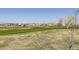 Scenic back view of the property overlooking a lush green golf course at 5131 Netherland St, Denver, CO 80249