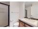 Bathroom with tiled shower, toilet, and vanity with sink at 5131 Netherland St, Denver, CO 80249