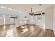 Elegant dining area with hardwood floors and a stylish chandelier, perfect for entertaining guests at 5131 Netherland St, Denver, CO 80249