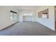 Bright living room featuring neutral carpet, large window, and fireplace at 5131 Netherland St, Denver, CO 80249