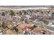 Aerial view of house, neighborhood, and distant lake at 4611 S Queen St, Littleton, CO 80127