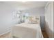 Bedroom with a double bed, white dresser, and built-in shelves at 4611 S Queen St, Littleton, CO 80127