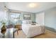 Bedroom with queen bed, wood dresser, and mountain views at 4611 S Queen St, Littleton, CO 80127