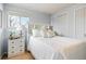 Bedroom with double bed, white dresser, and closet at 4611 S Queen St, Littleton, CO 80127