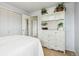 Bedroom with white dresser and built-in storage at 4611 S Queen St, Littleton, CO 80127