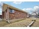 Brick ranch house with a spacious backyard at 4611 S Queen St, Littleton, CO 80127