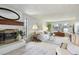 Living room with fireplace and plenty of natural light at 4611 S Queen St, Littleton, CO 80127