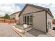 Back of the house featuring low-maintenance landscaping, siding, and a sliding glass door to the backyard at 9643 Birch Ln, Thornton, CO 80229