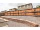 Fenced backyard featuring low maintenance landscaping, a retaining wall, and a private outdoor space at 9643 Birch Ln, Thornton, CO 80229