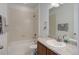 Bathroom featuring a sink with granite vanity top, and a tiled shower-tub at 9643 Birch Ln, Thornton, CO 80229
