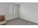 Bedroom with carpet flooring, window with blinds, and blank walls at 9643 Birch Ln, Thornton, CO 80229