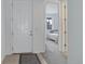 Bright entryway featuring a white front door and a glimpse into a cozy bedroom with natural light at 9643 Birch Ln, Thornton, CO 80229