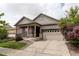 Inviting two-story home with an attached garage and a charming front porch with beautiful landscaping at 9643 Birch Ln, Thornton, CO 80229