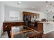 Bright eat-in kitchen featuring wood cabinets, granite counters, black appliances, and hardwood floors at 9643 Birch Ln, Thornton, CO 80229