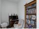Functional home office with a bookshelf, wooden desk, and comfortable chair at 9643 Birch Ln, Thornton, CO 80229