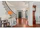 Bright entryway featuring hardwood floors, grand staircase, and elegant decor at 344 Saint Paul St, Denver, CO 80206