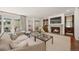 Spacious living room with a cozy fireplace, stylish furniture, and seamless access to the outdoor area at 344 Saint Paul St, Denver, CO 80206