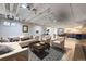 Finished basement living area, featuring L-shaped sofa and modern decor at 7023 S Buffalo St, Littleton, CO 80120