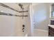 Updated bathroom with shower/tub combo and tile at 7023 S Buffalo St, Littleton, CO 80120