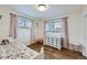 Light and airy bedroom with hardwood floors at 7023 S Buffalo St, Littleton, CO 80120