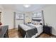 Bright bedroom with a comfortable bed and hardwood floors at 7023 S Buffalo St, Littleton, CO 80120