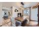 Dining area with farmhouse style table and view into the kitchen at 7023 S Buffalo St, Littleton, CO 80120