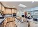 Updated kitchen with island, stainless steel appliances, and open concept design at 7023 S Buffalo St, Littleton, CO 80120