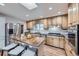 Modern kitchen with stainless steel appliances and wood cabinets at 7023 S Buffalo St, Littleton, CO 80120