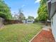Large backyard with detached garage, lawn, and wood fence at 4232 S Grant St, Englewood, CO 80113