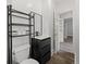 Bathroom featuring a vanity, toilet, shelving and wood-look floors at 4232 S Grant St, Englewood, CO 80113