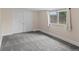 Bedroom featuring neutral carpet, a double-door closet, and a window at 4232 S Grant St, Englewood, CO 80113
