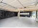 Spacious detached garage with a concrete floor, partially covered interior, and natural light at 4232 S Grant St, Englewood, CO 80113