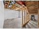 Unfinished basement featuring exposed framing, utilities, and concrete floors at 15602 E 117Th Ave, Commerce City, CO 80022