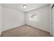 Bedroom with neutral carpet, white walls, and natural light from a window at 15602 E 117Th Ave, Commerce City, CO 80022