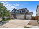 Charming two-story home with a three-car garage and well-maintained landscaping at 15602 E 117Th Ave, Commerce City, CO 80022