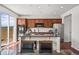Open kitchen with granite countertops, stainless appliances, and hardwood floors, blending style and function at 15602 E 117Th Ave, Commerce City, CO 80022