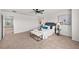 Spacious main bedroom with a ceiling fan, stylish decor, and an inviting view at 15602 E 117Th Ave, Commerce City, CO 80022