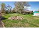 Beautifully landscaped backyard with green grass, garden beds, and patio space at 1542 Kilkenny, Boulder, CO 80303