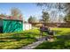 Spacious backyard featuring a grill and storage sheds at 1542 Kilkenny, Boulder, CO 80303