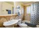 Cozy bathroom featuring tub, shower, toilet, and a stylish vanity at 1542 Kilkenny, Boulder, CO 80303