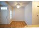 Simple dining area with hardwood floors and ceiling fan at 14207 E Grand Dr # 76, Aurora, CO 80015